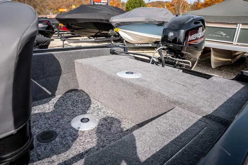 Slide: The Image of 2025 Bass Tracker Super Guide V-16 SC boat interior with Mercury engine. - 12