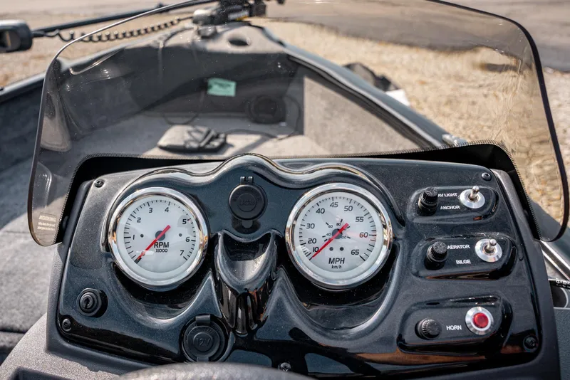 Slide: The Image of 2025 Bass Tracker Super Guide V-16 SC dashboard with speedometer and RPM gauges. - 16