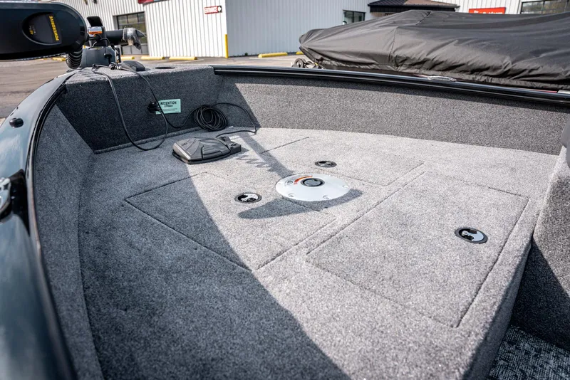 Slide: The Image of 2025 Bass Tracker Super Guide V-16 SC boat interior with carpeted deck. - 7