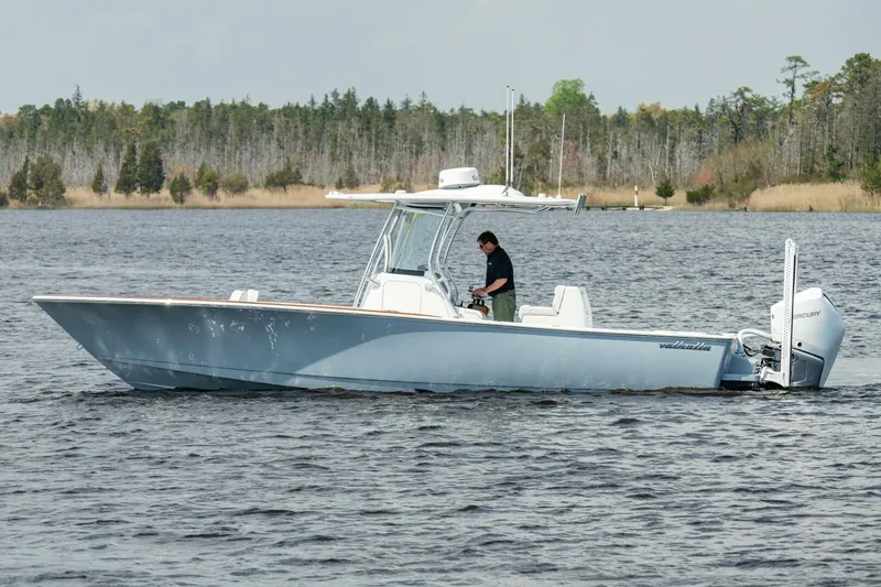 Slide: The Image of 2025 Valhalla Boatworks V-29 Hybrid cruising on a serene lake. - 20
