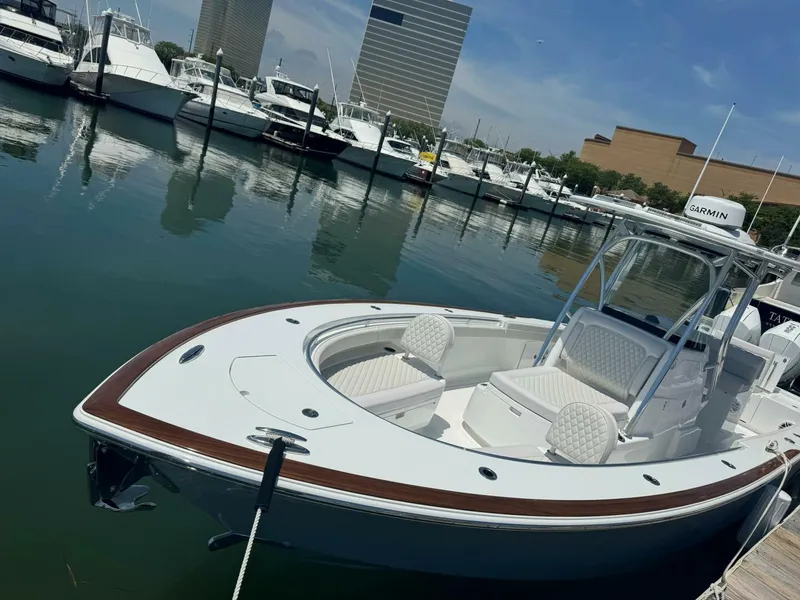 Slide: The Image of 2025 Valhalla Boatworks V-29 Hybrid docked in marina, surrounded by other boats. - 3
