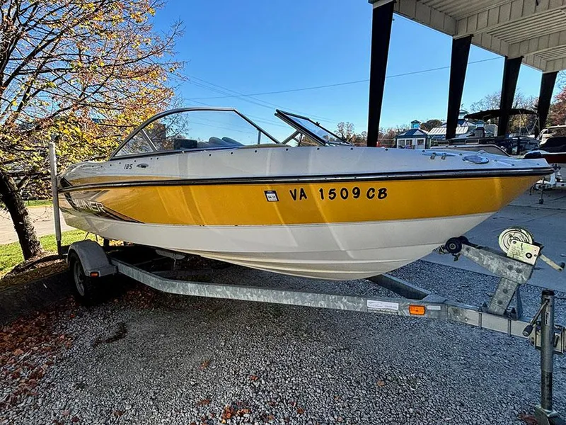 The Image of 2012 Bayliner 185 Bowrider boat on trailer, yellow and white exterior. - 0
