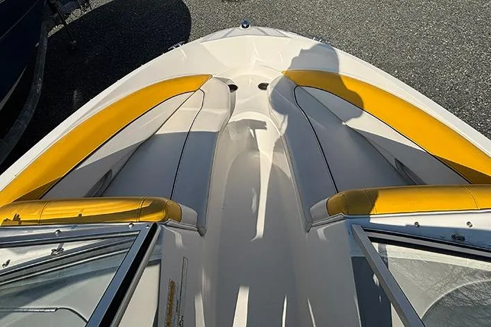 Slide: The Image of 2012 Bayliner 185 Bowrider with yellow seating, viewed from above. - 12