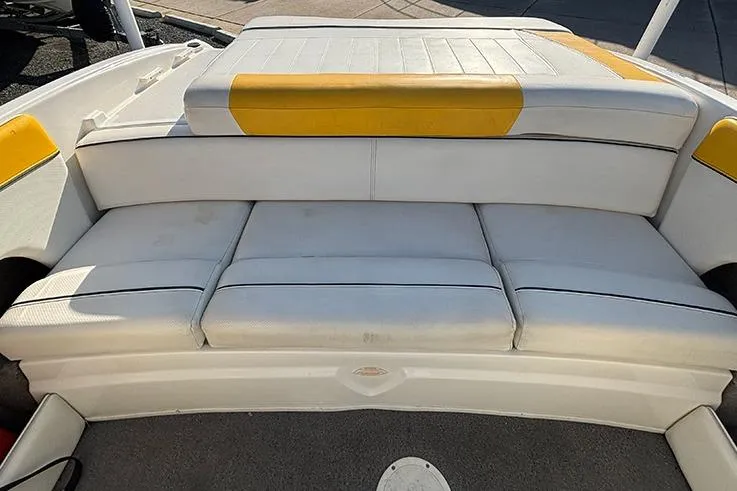 Slide: The Image of 2012 Bayliner 185 Bowrider boat interior with white and yellow seating. - 15