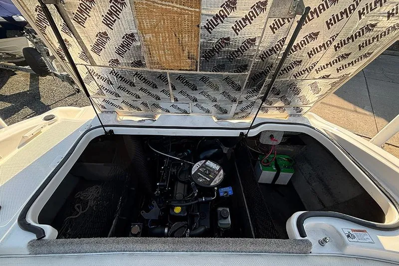 Slide: The Image of 2012 Bayliner 185 Bowrider engine compartment with Kilmat insulation visible. - 20