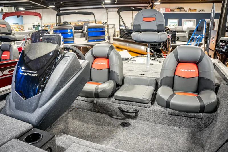 Slide: The Image of 2025 Bass Tracker PRO TEAM 190 boat interior with seating and console. - 12