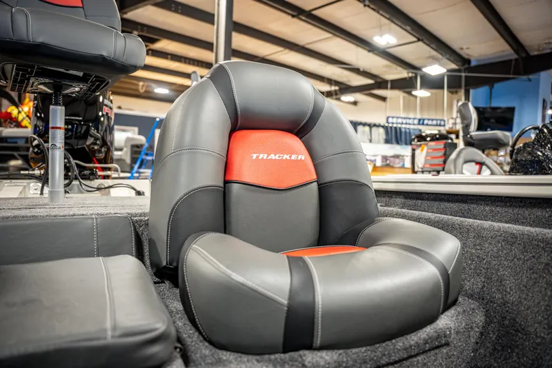 Slide: The Image of 2025 Bass Tracker PRO TEAM 190 boat seat, black and red design, showroom display. - 14