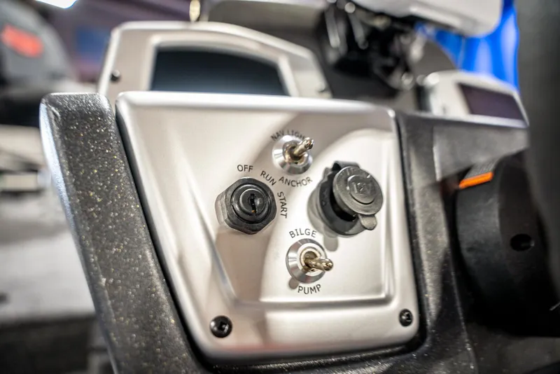 Slide: The Image of Control panel of 2025 Bass Tracker PRO TEAM 190 boat, featuring switches and dials. - 18
