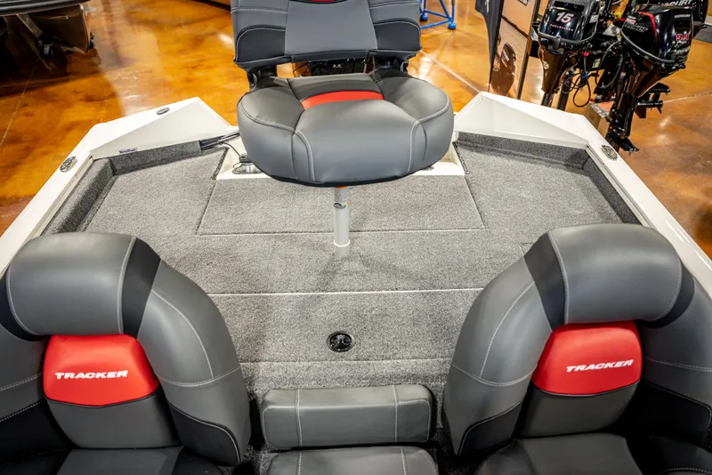Slide: The Image of 2025 Bass Tracker PRO TEAM 190 boat interior with gray and red seating. - 19