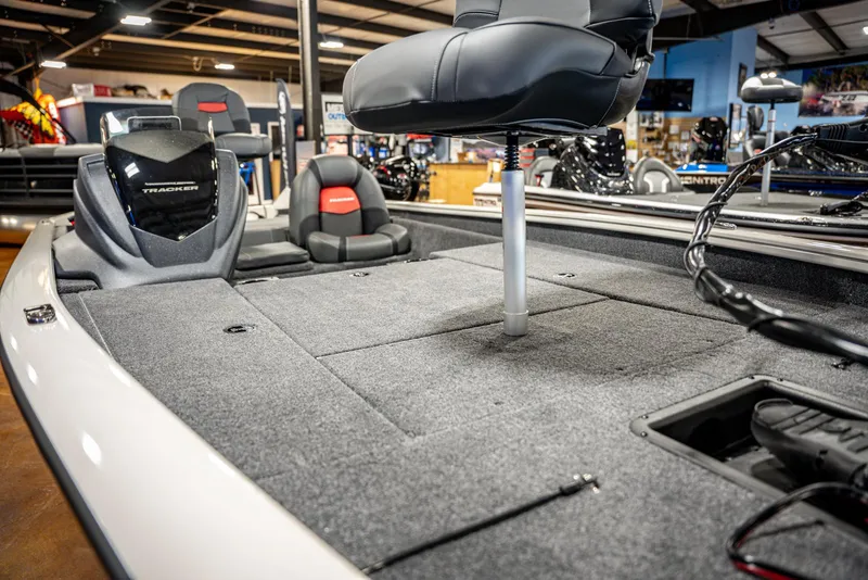 Slide: The Image of 2025 Bass Tracker PRO TEAM 190 boat interior with seating and storage compartments. - 6