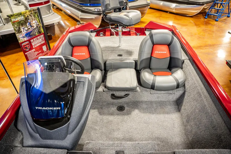 Slide: The Image of 2025 Bass Tracker Pro Team 175 boat interior with seating and console. - 11