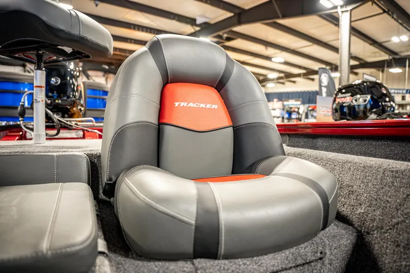Slide: The Image of 2025 Bass Tracker Pro Team 175 boat seat, gray and red design. - 12