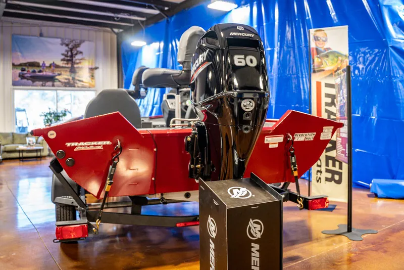 Slide: The Image of 2025 Bass Tracker Pro Team 175 boat with Mercury 60 engine in showroom. - 3