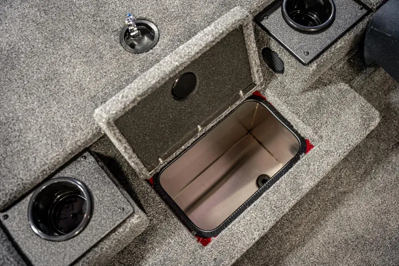 Slide: The Image of 2025 Bass Tracker Pro Team 175 boat storage compartment with cup holders. - 10