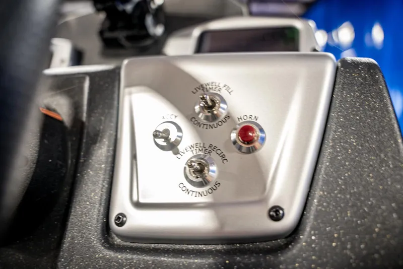 Slide: The Image of Control panel of 2025 Bass Tracker Pro Team 175 boat with switches and buttons. - 15
