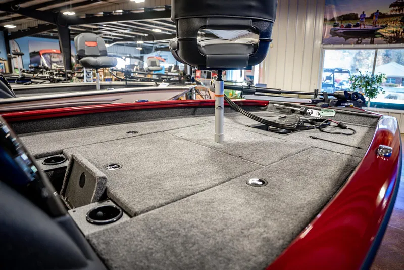 Slide: The Image of 2025 Bass Tracker Pro Team 175 boat interior with carpeted deck and seating. - 6