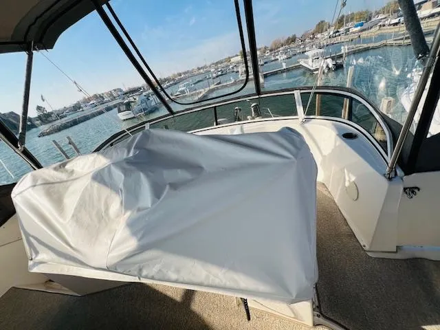 Slide: The Image of 1999 Silverton 392 Motor Yacht interior with marina view. - 15