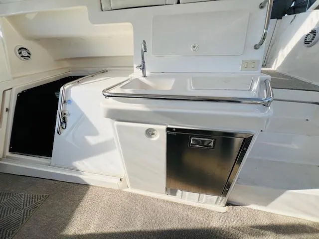 Slide: The Image of 1999 Silverton 392 Motor Yacht interior with sink and storage area. - 7