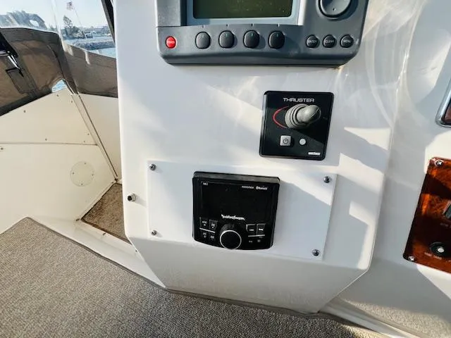Slide: The Image of Control panel of a 1999 Silverton 392 Motor Yacht with thruster and audio system. - 9
