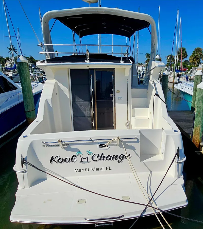Slide: The Image of 2005 Silverton 330 Sport Bridge docked at Merritt Island, FL marina. - 2