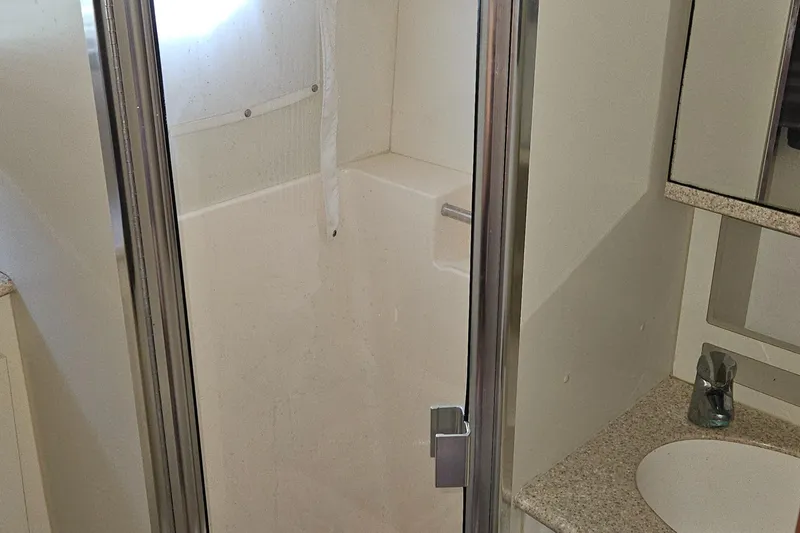 Slide: The Image of 2005 Silverton 330 Sport Bridge bathroom with shower and sink. - 21