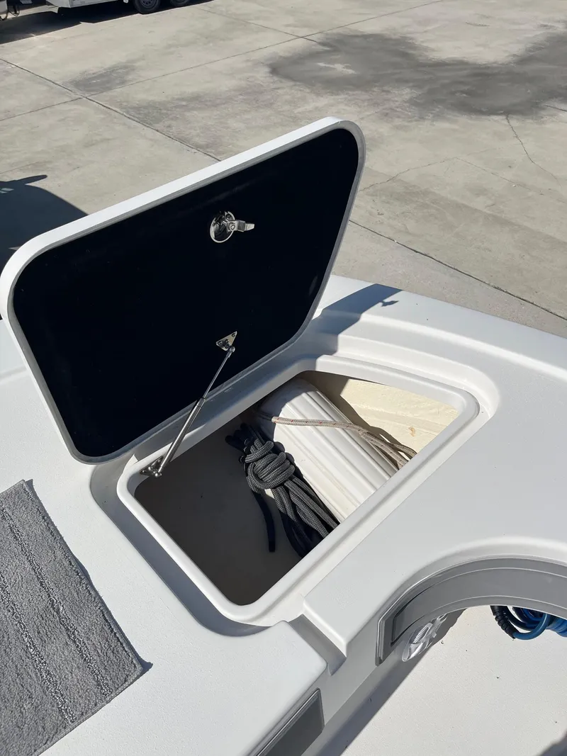 Slide: The Image of Open storage compartment on 2021 Tideline 365 boat deck. - 11
