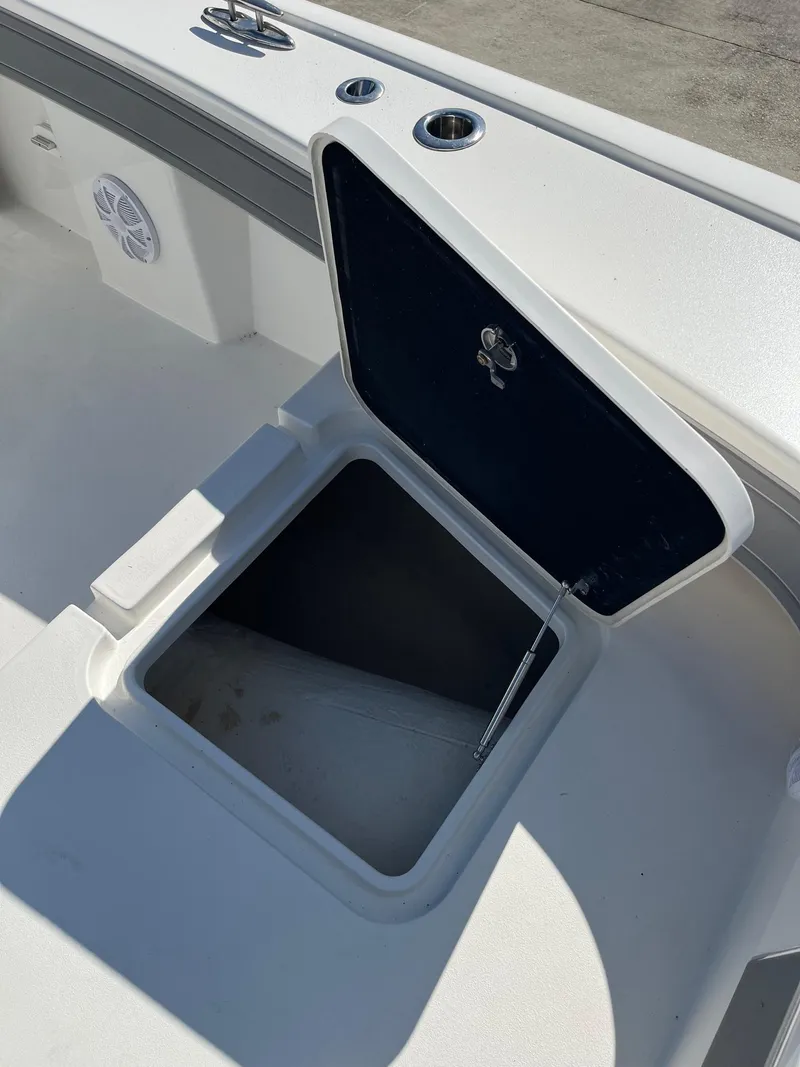 Slide: The Image of Open storage compartment on 2021 Tideline 365 boat deck. - 13