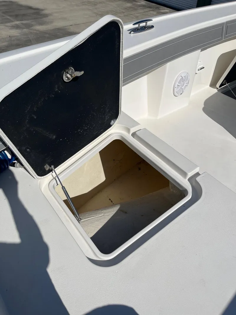 Slide: The Image of Open storage compartment on 2021 Tideline 365 boat deck. - 15