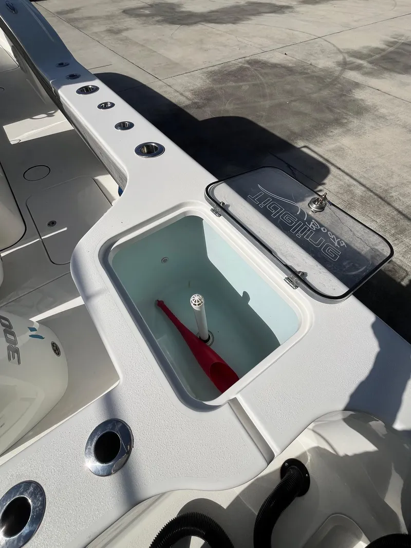 Slide: The Image of 2021 Tideline 365 boat deck with open storage compartment. - 21
