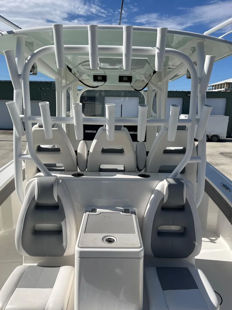 Slide: The Image of 2021 Tideline 365 boat interior with seating and rod holders. - 23