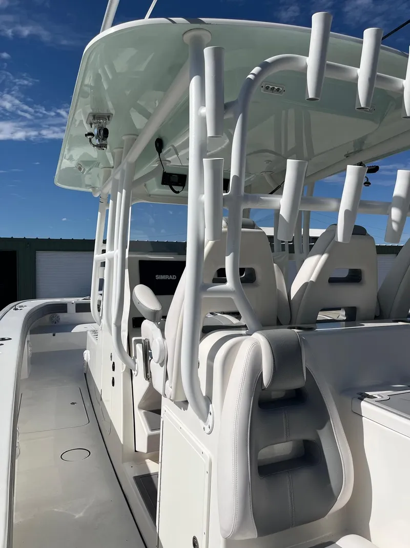 Slide: The Image of 2021 Tideline 365 boat interior with white seating and modern design. - 25