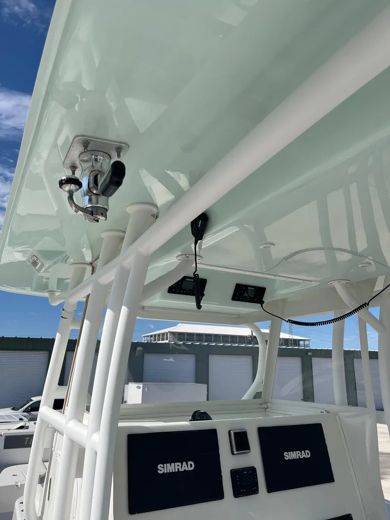 Slide: The Image of 2021 Tideline 365 boat console with Simrad electronics under a hardtop. - 27