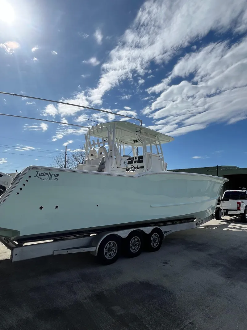 Slide: The Image of 2021 Tideline 365 boat on trailer under blue sky. - 3