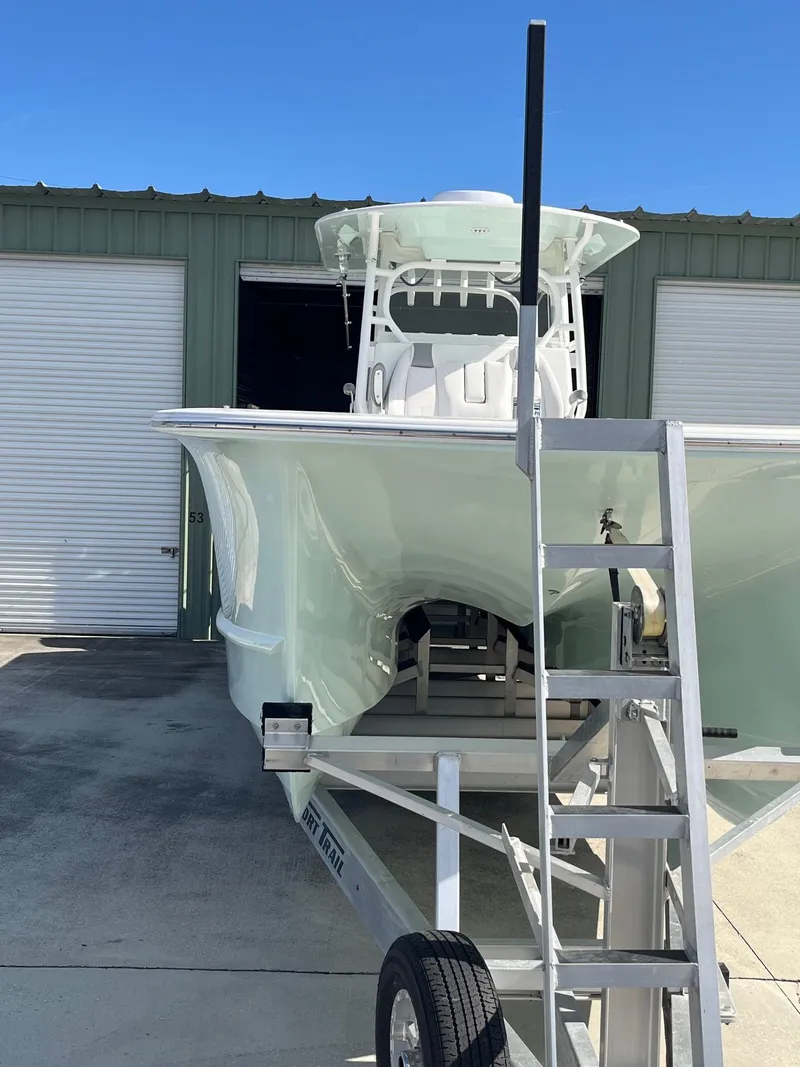 Slide: The Image of 2021 Tideline 365 boat on trailer outside storage facility. - 31