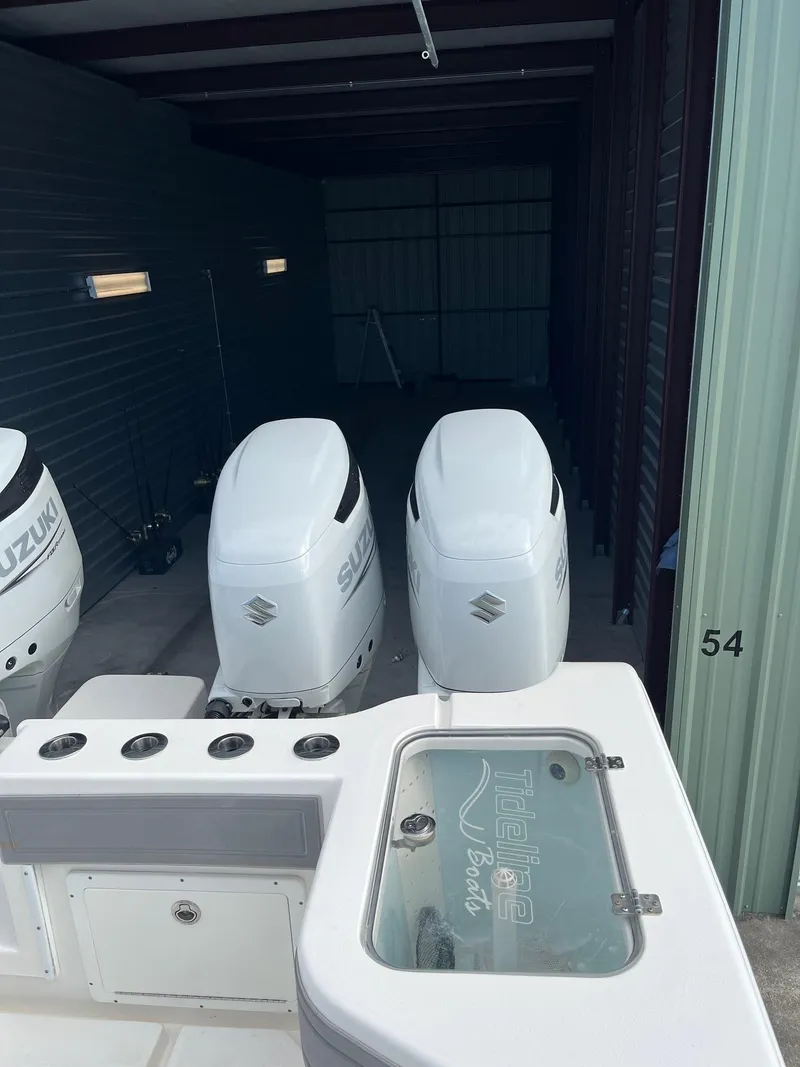 Slide: The Image of 2021 Tideline 365 boat with Suzuki outboard engines in storage unit. - 34