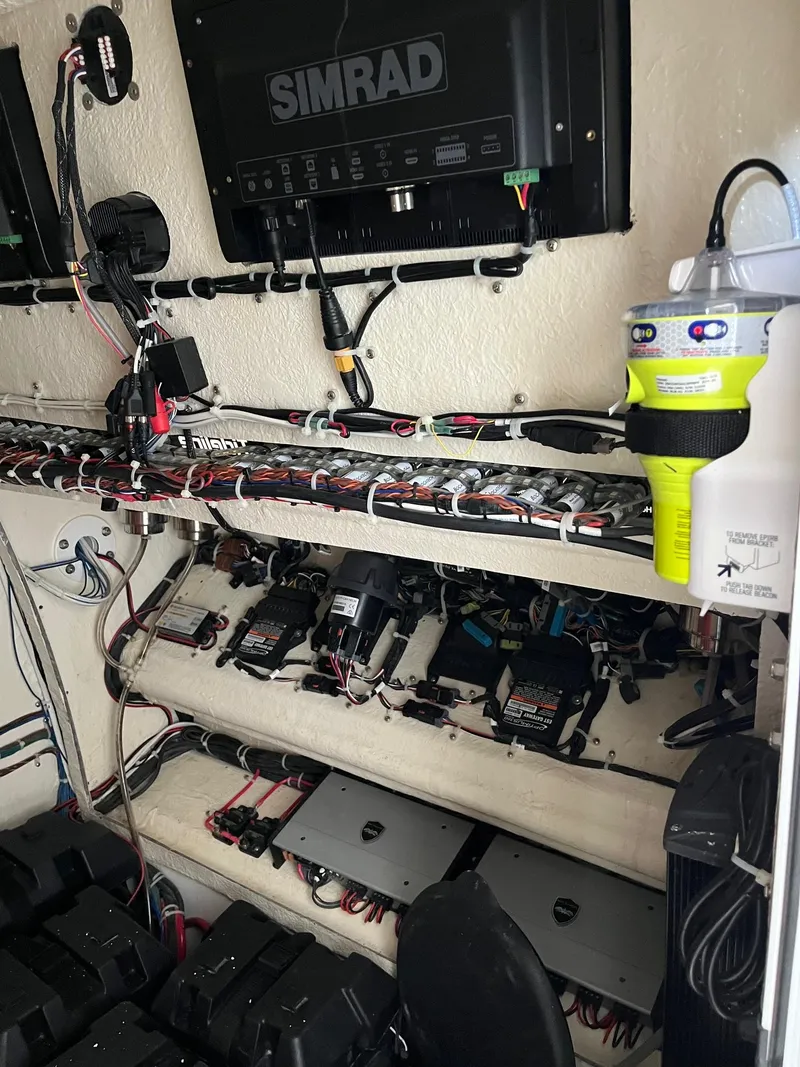 Slide: The Image of 2021 Tideline 365 boat electronics setup with Simrad system and wiring. - 40