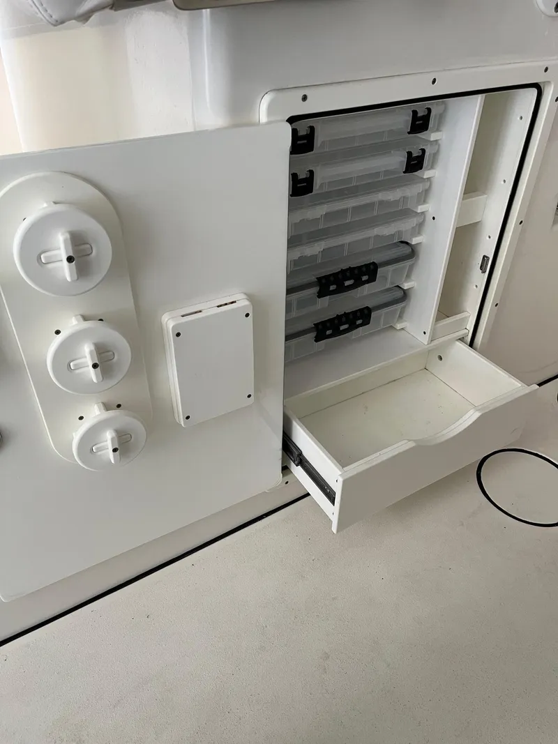 Slide: The Image of Open storage compartment on a 2021 Tideline 365 boat. - 41