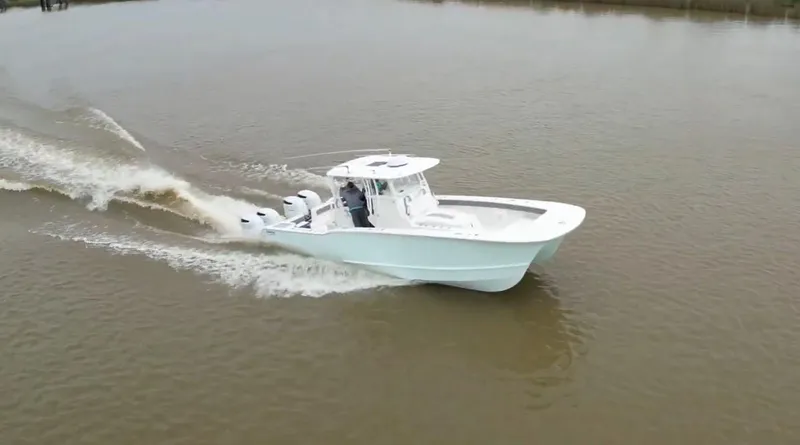 Slide: The Image of 2021 Tideline 365 boat cruising on a calm river. - 44