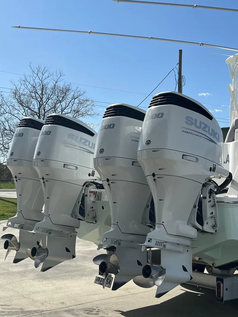 Slide: The Image of Four Suzuki outboard motors on a 2021 Tideline 365 boat. - 9