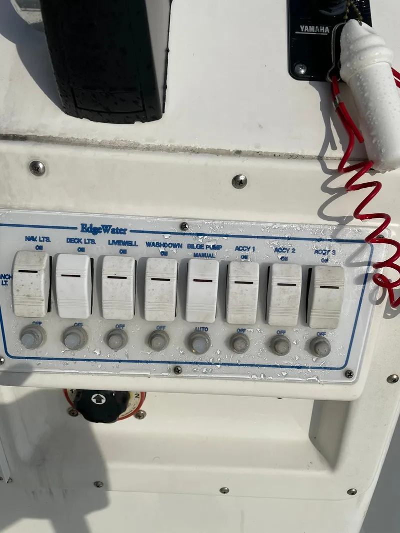 Slide: The Image of Edgewater 247CC 2000 boat control panel with labeled switches and Yamaha accessory. - 11