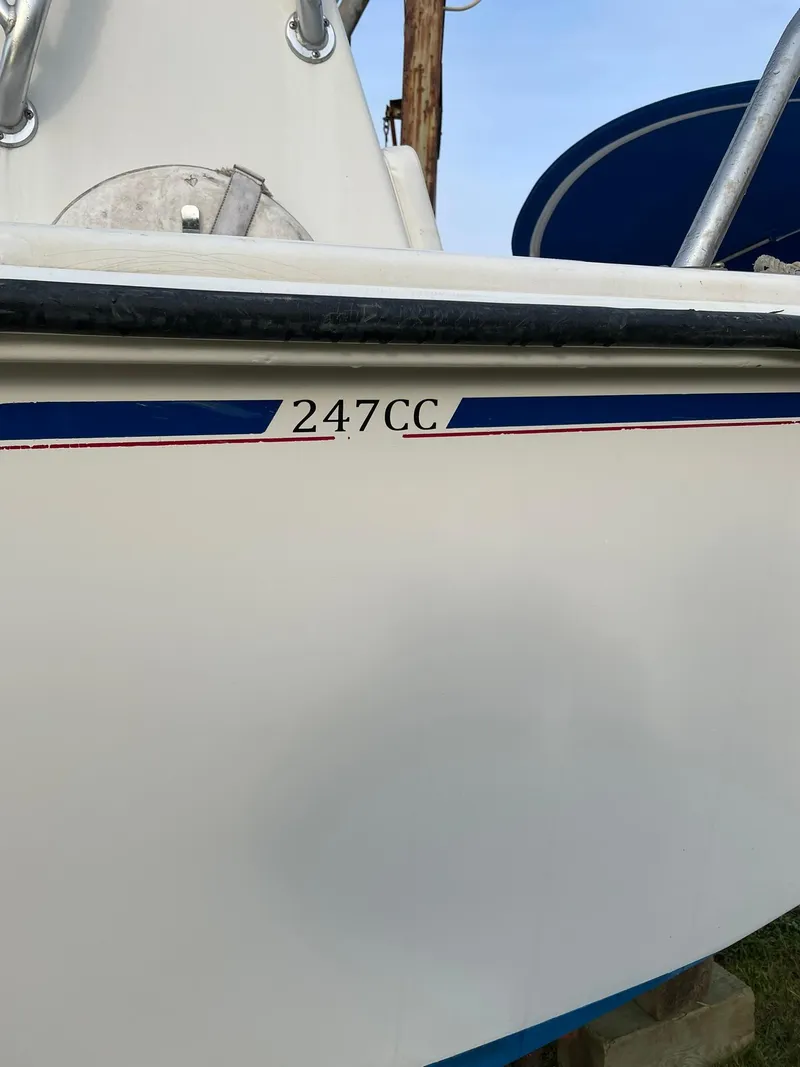Slide: The Image of Edgewater 247CC boat, 2000 model, white hull with blue accents. - 2