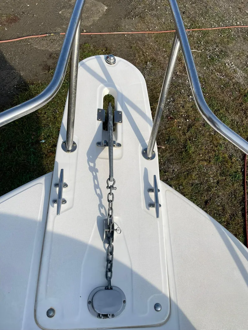 Slide: The Image of Bow of 2000 Edgewater 247CC boat with anchor chain and stainless steel rails. - 28