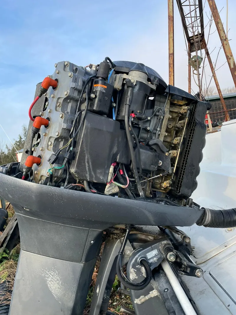 Slide: The Image of Edgewater 247CC 2000 outboard motor with exposed engine components. - 35