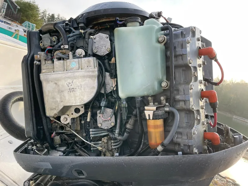 Slide: The Image of Edgewater 247CC 2000 boat engine, detailed view of components and wiring. - 36
