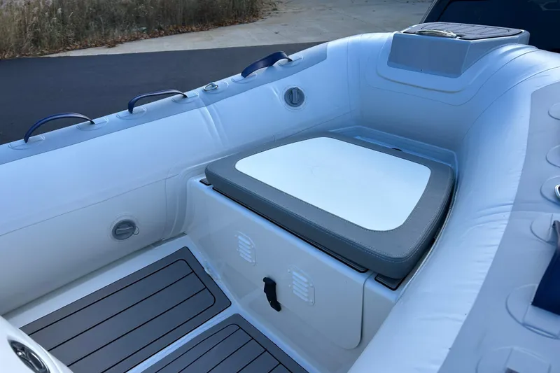 Slide: The Image of 2026 Highfield Classic 360 GT boat interior with cushioned seating and sleek design. - 15