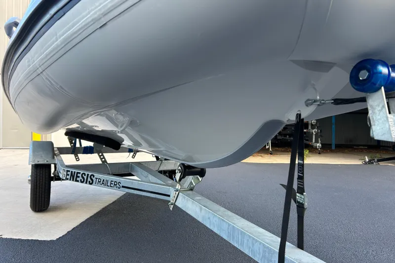 Slide: The Image of 2026 Highfield Classic 360 GT boat on Genesis trailer, close-up view. - 18
