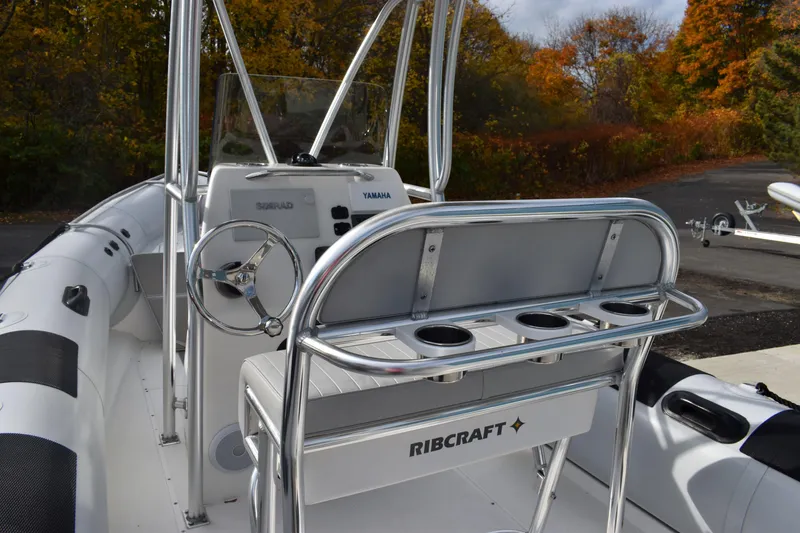 Slide: The Image of Ribcraft 7.8 boat, 2015 model, on trailer near industrial building. - 2