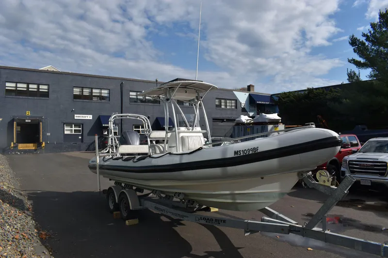 Slide: The Image of 2015 Ribcraft 7.8 boat with Yamaha 250 engine, parked outdoors. - 9