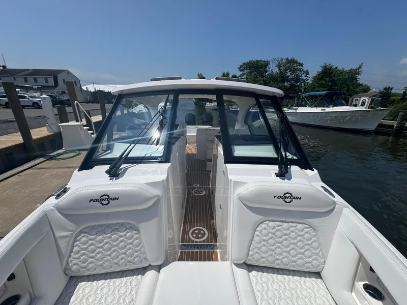 Slide: The Image of 2025 Fountain 39 DX boat docked, featuring sleek design and luxurious seating. - 15