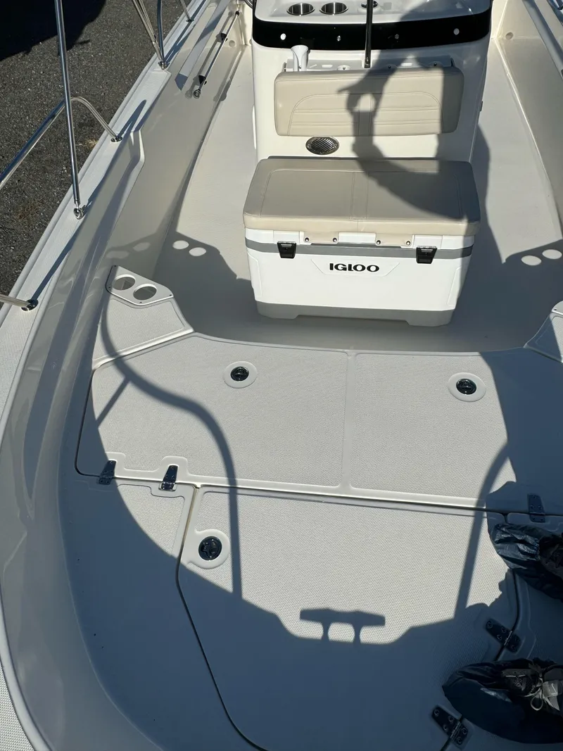 Slide: The Image of 2024 Boston Whaler 190 Montauk boat interior with Igloo cooler and seating. - 13